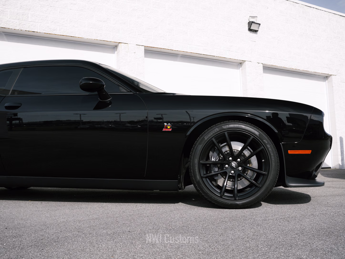 Black Dodge Challenger outside the shop