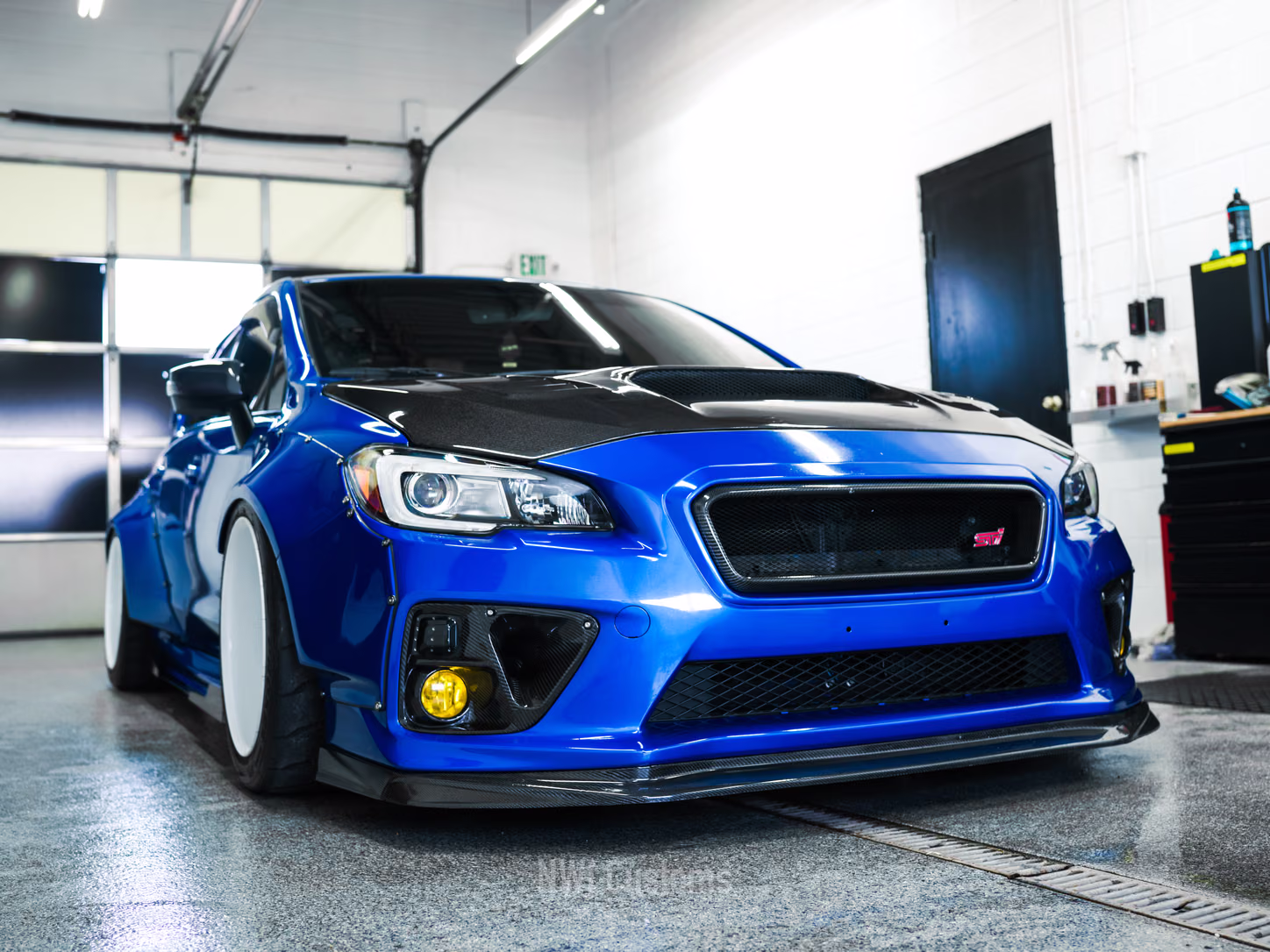 Blue Subaru WRX in the bay